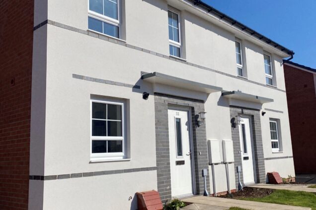 Semi-detached homes with white render