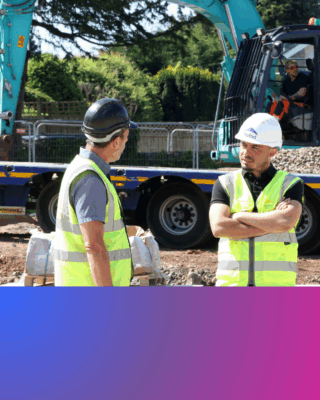A Hafod colleague at a development site with a digger in the background
