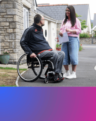 A colleague with a customer in a wheelchair