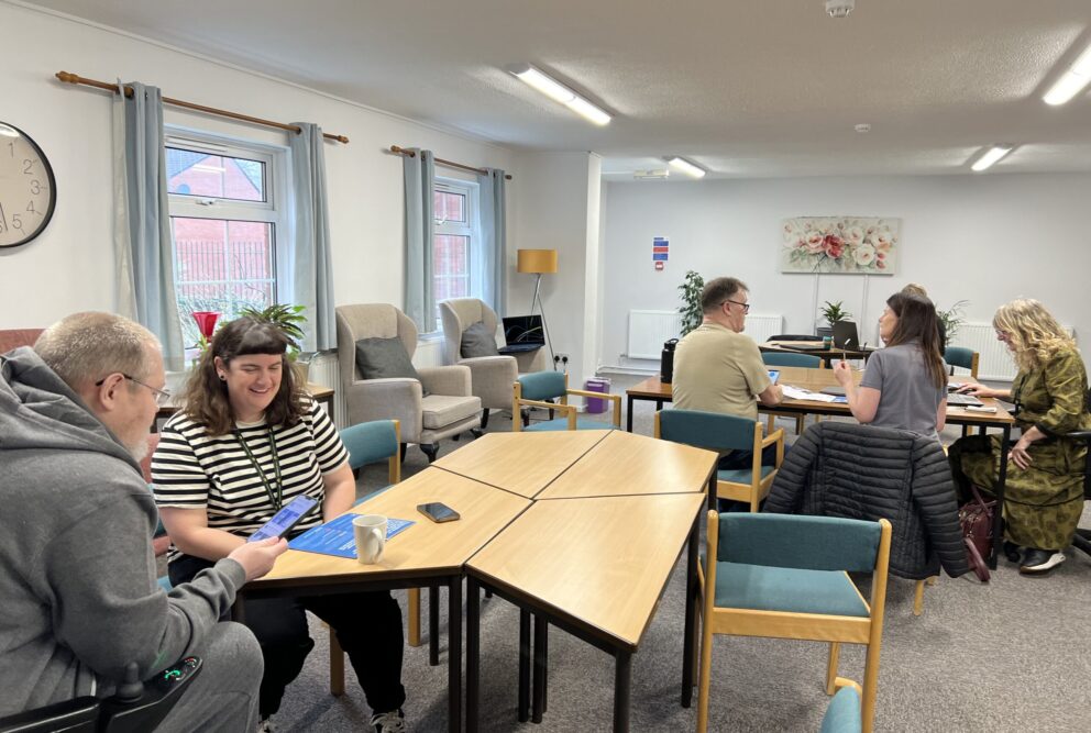 Hafod Housing Association footprint decarbonisation community engagement day customers and colleagues getting help with smart apps