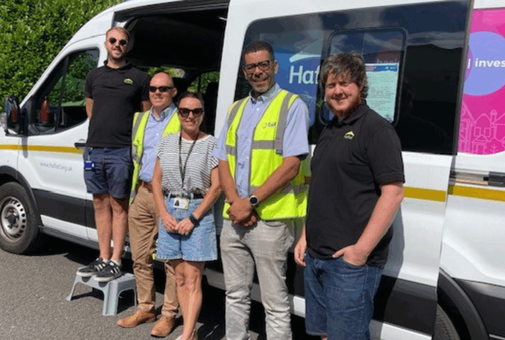 Hafod Housing Association footprint decarbonisation community engagement day colleagues and partners standing next to D.A.V.E. the Hafod van