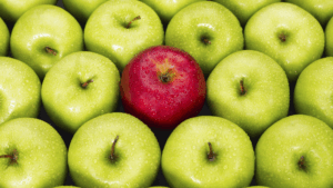 green apples with a red apple in the middle
