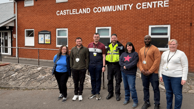 Hafod Housing Association neighbourhood coaches with a PSCO infront of a community centre
